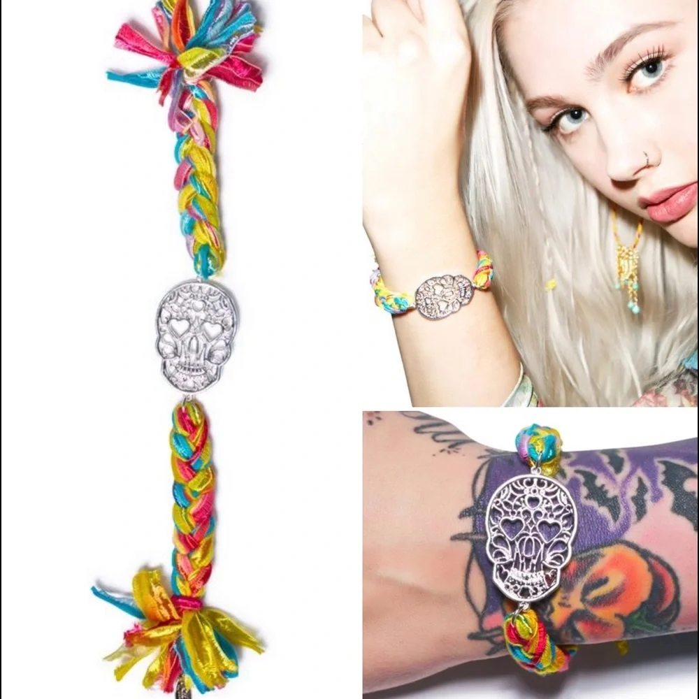 Two DollsKill Ettika Vintage Skull Ribbon Braided Bracelets with Gold Clasps